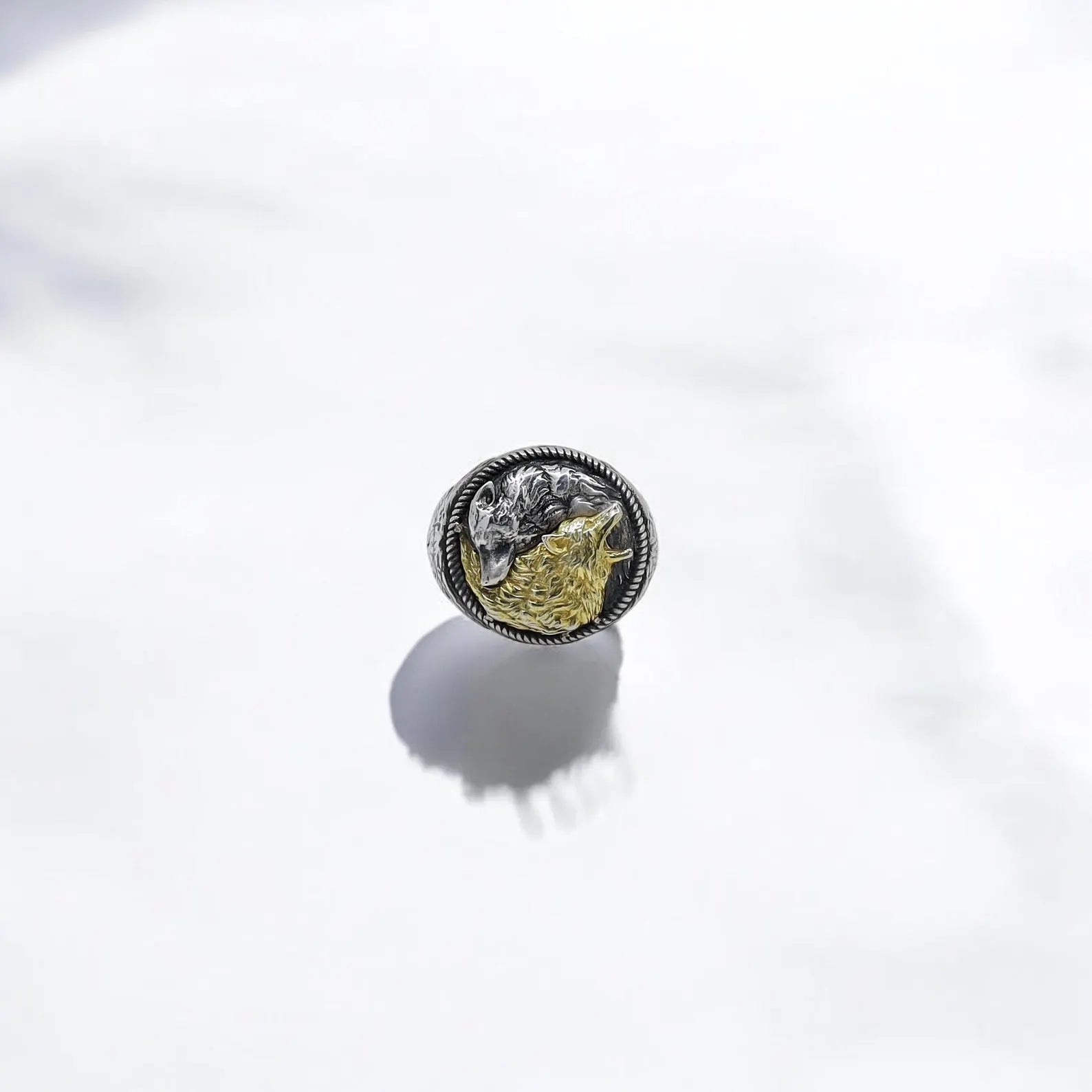 An overhead angle of the yin yang wolf ring emphasizes its bold design and thick band, perfect for daily wear or special occasions. With its powerful symbolism and handcrafted artistry, this ring attracts buyers searching for spiritual gifts for men, wolf totem jewelry, or personalized anniversary gifts.