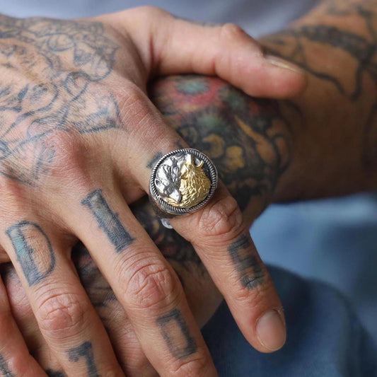 A detailed close-up of the Yin Yang Wolf ring reveals the exquisite craftsmanship of the gold-plated silver. The design combines intricate wolf engravings with the iconic yin yang motif, symbolizing unity and duality. This handcrafted ring is ideal for men seeking symbolic jewelry with a rugged, mystical aesthetic, making it a top search result for spiritual gift ideas for him.