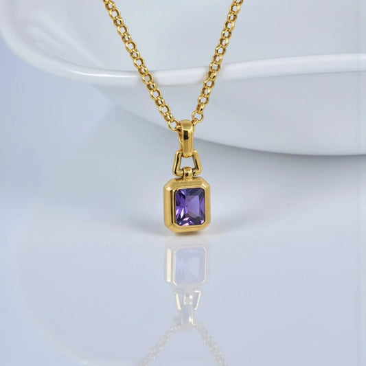 Luxury 18K gold plated amethyst gemstone pendant necklace crafted from solid 925 sterling silver, featuring a rich violet oval-cut amethyst stone on a minimalist unisex chain, photographed in high-detail studio lighting