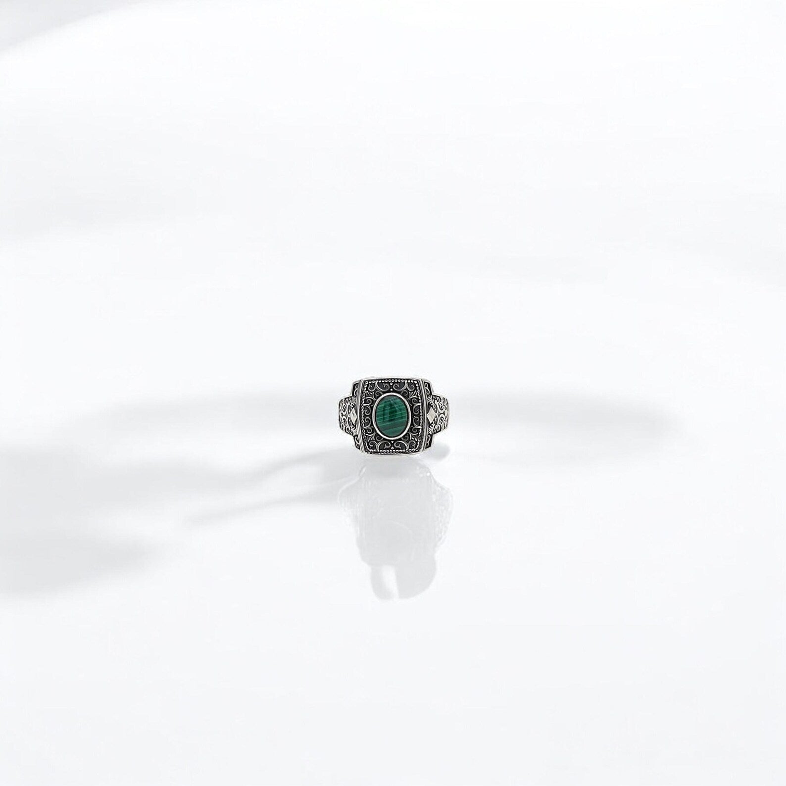 Elevate your everyday style with this engraved silver malachite ring, handcrafted from 925K sterling silver. The gothic-inspired scrollwork and vintage-style engravings offer a sense of timeless masculinity, while the green malachite gemstone infuses the design with nature’s grounding energy. Whether you're a spiritual seeker, a lover of gothic aesthetics, or simply a man with bold style, this piece offers wearable symbolism and artisan heritage in one.