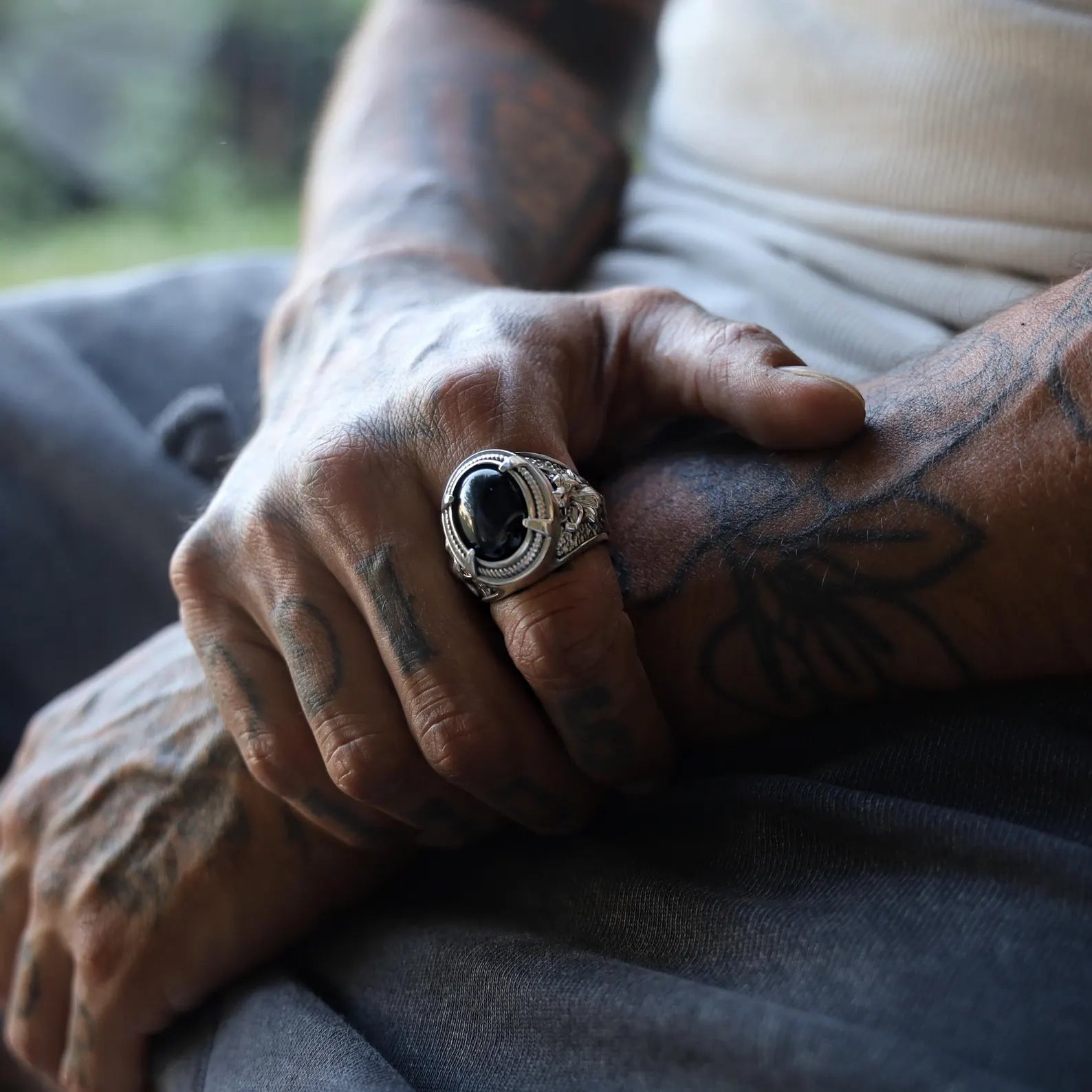 This men's silver ring makes a bold statement with its deep-set black onyx gemstone and detailed wolf engraving on each side. Representing wild instincts and protective spirit, this handcrafted piece combines fantasy, heritage, and raw power in one wearable form. Ideal for gifting or personal reflection, it carries meaning beyond fashion.