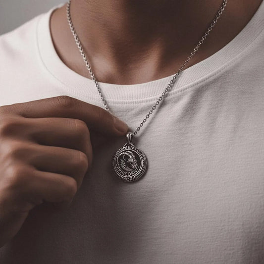 Close-up of a Capricorn zodiac Sea-Goat pendant crafted in sterling silver, showing gothic engravings, oxidized texture and handcrafted details for astrology and gothic jewelry lovers