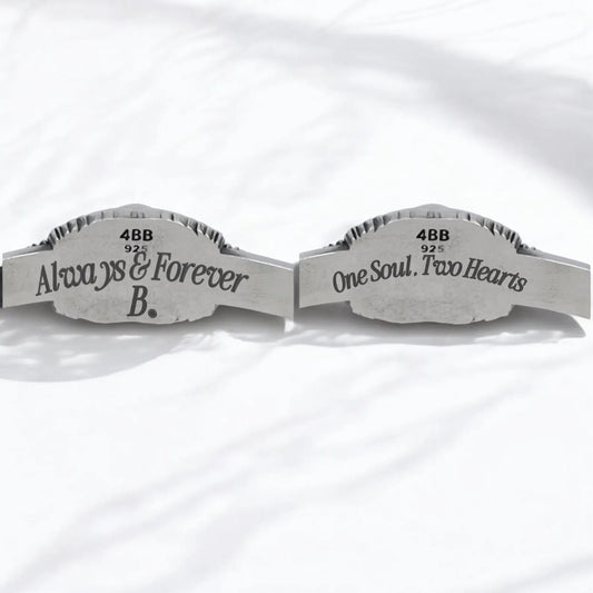 Elegant studio photo of a black onyx silver cuff bracelet for men, designed with twin skulls and intricate engravings. This gothic masterpiece blends timeless craftsmanship with dark elegance — ideal for collectors of artisan silver jewelry and those who value unique style.