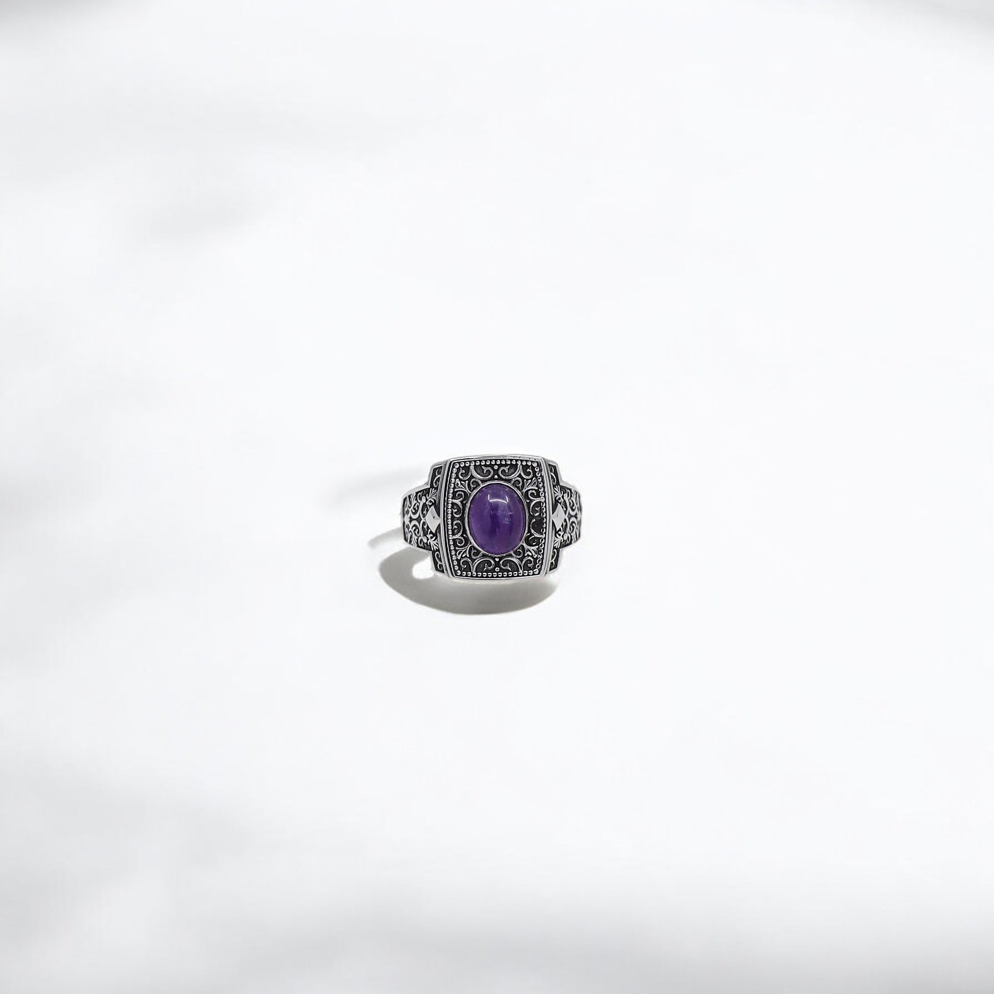 Elevate your jewelry collection with this one-of-a-kind handcrafted silver amethyst ring. The deep purple gemstone is set into a square bezel adorned with traditional engravings that reflect both strength and sophistication. Whether worn daily or for special occasions, this statement ring enhances any outfit and makes a remarkable gift for the man who appreciates artisan quality and symbolic beauty.