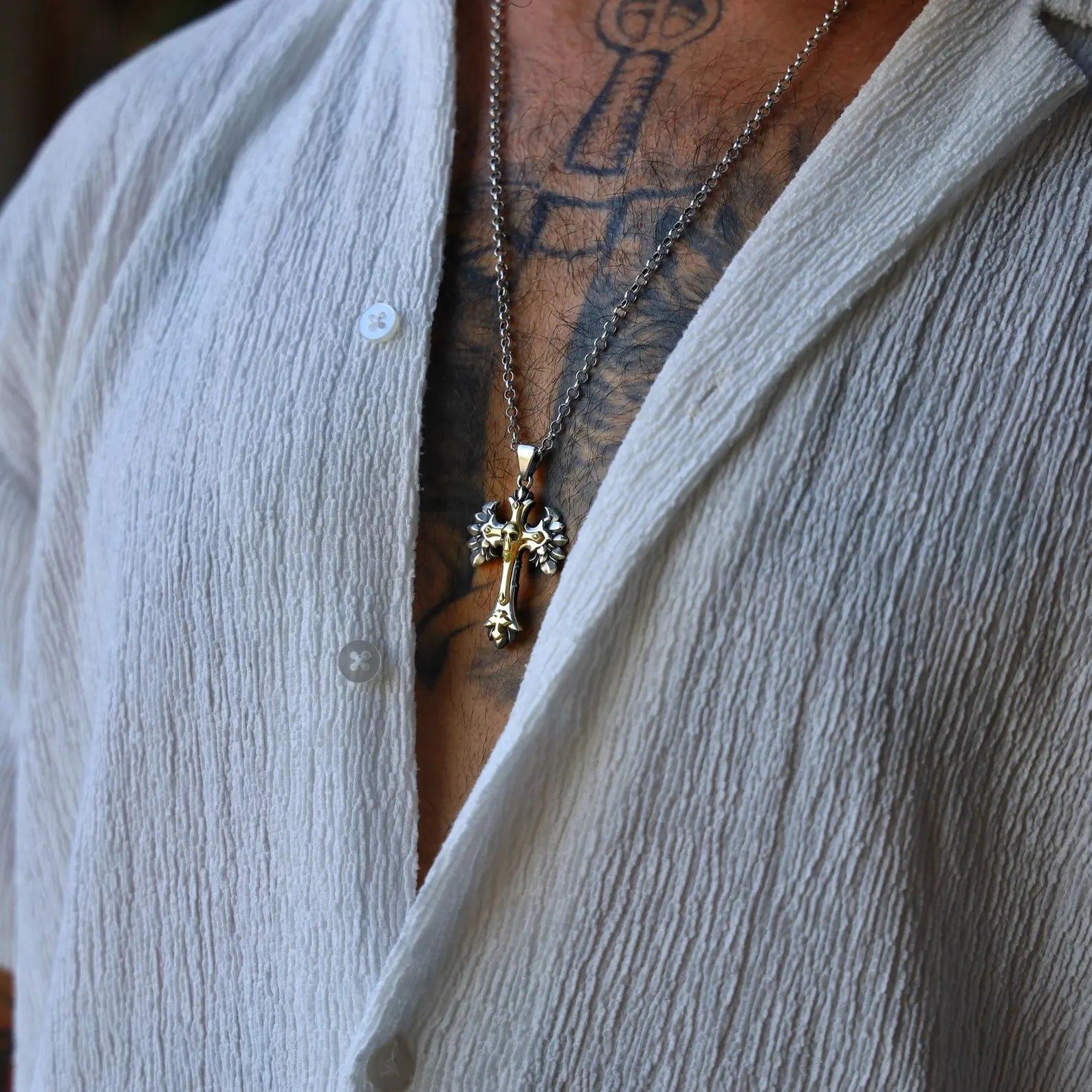 This bold gothic cross pendant necklace combines dark spirituality and medieval symbolism in a handcrafted design. Made from 925 sterling silver with gold-plated accents, the pendant features a skull and wing motif for a dramatic, timeless look. Ideal for gothic style lovers, rockers, or anyone seeking powerful, symbolic jewelry.