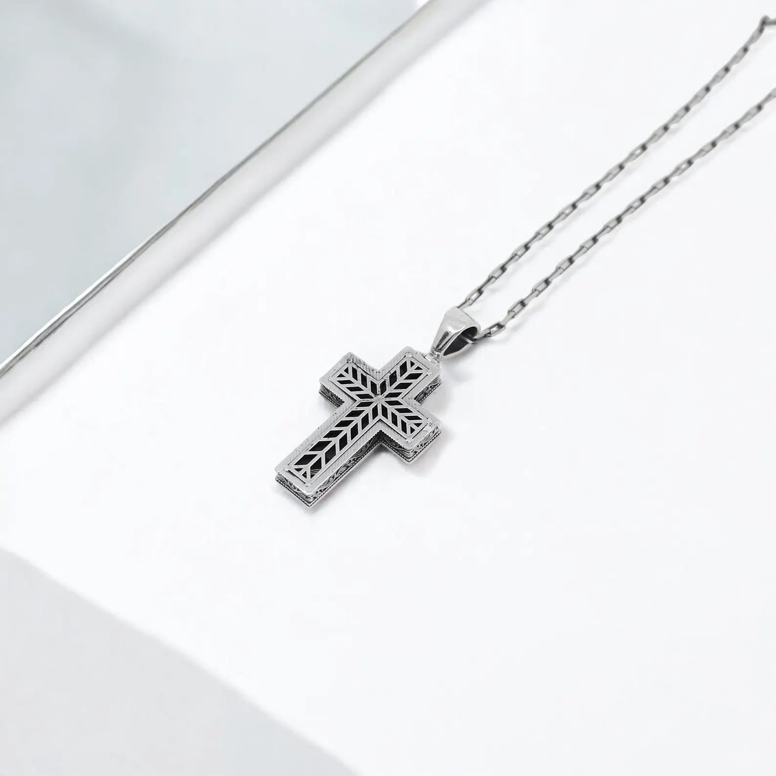 Heavy metal style silver cross necklace with skull details, crafted for men who love gothic and biker fashion. Strong sterling silver build with a bold, symbolic design. Perfect gift for rock fans, riders, and alternative style enthusiasts.