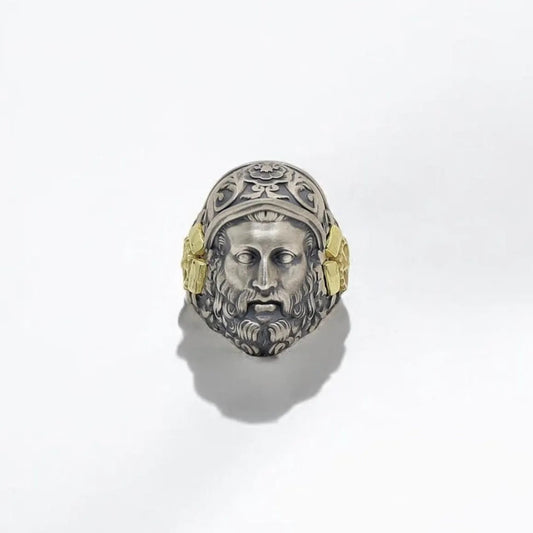 This handcrafted Hephaestus Greek God ring is a bold fusion of ancient symbolism and modern craftsmanship. Made from solid 925 sterling silver and adorned with 14k gold-plated accents, it honors the god of fire, metalwork, and invention. Featuring deep engraving of Hephaestus’s face and a warrior helmet, this ring is a timeless statement for men who admire mythology, creativity, and strength. Ideal as a powerful gift for anniversaries, birthdays, or as a wearable piece of historical art.