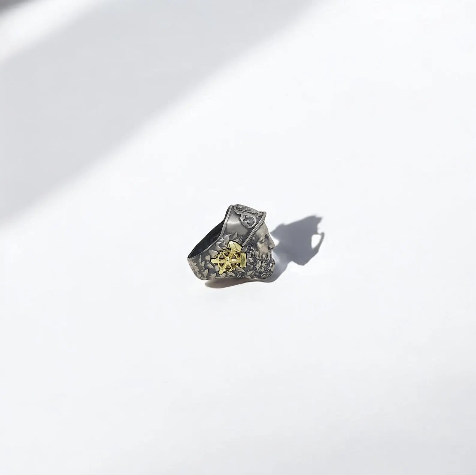 Close-up view of our handcrafted 14K gold plated Hephaestus ring for men, showcasing the intricate detailing inspired by Greek mythology. This unique mythology jewelry piece, made of solid sterling silver, symbolizes the god of craftsmanship and is a bold statement accessory for fans of ancient legends, artisan design, and masculine style.