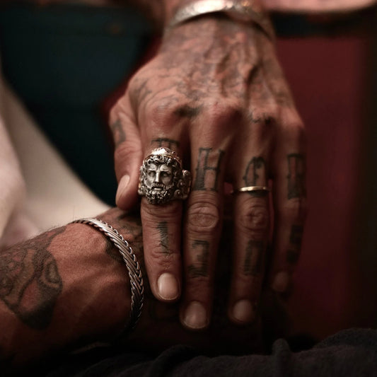 Crafted with precision and mythology in mind, this sterling silver and gold Poseidon ring embodies the oceanic force and regal energy of the Greek god of the seas. The ring's large face—measuring nearly 30mm in height—is adorned with meticulously engraved marine motifs symbolizing mastery, courage, and elemental connection. The contrasting 14K gold accents elevate its visual appeal, making it a timeless gift for men who embrace both elegance and mythological power.  birthday, anniversary