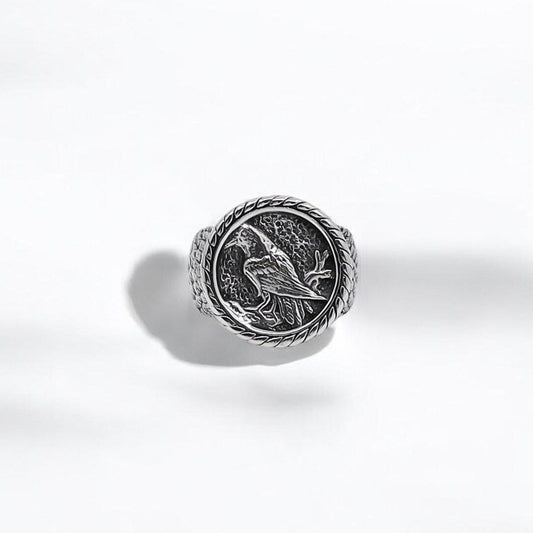 A handcrafted Norse raven ring made of high-quality silver, showcasing an intricately engraved raven motif inspired by Viking mythology. This powerful piece symbolizes wisdom, transformation, and divine protection, making it a meaningful gift for men who resonate with ancient legends and warrior spirit.