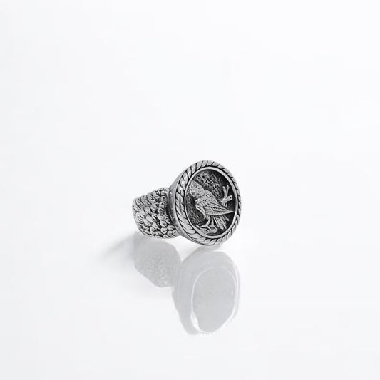 An artisan silver Viking ring featuring a detailed raven design rooted in Norse mythology, representing knowledge and connection to the gods. This bold statement ring is crafted for modern-day warriors who value symbolism, heritage, and exceptional craftsmanship.
