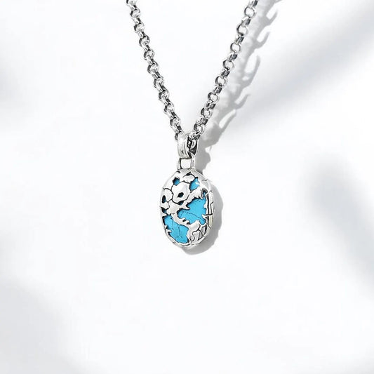 Handmade sterling silver necklace featuring a vivid turquoise stone set within a detailed nautical world map design. This elegant unisex pendant offers a perfect balance of style and meaning, crafted with precision and perfect for gifting on any occasion.