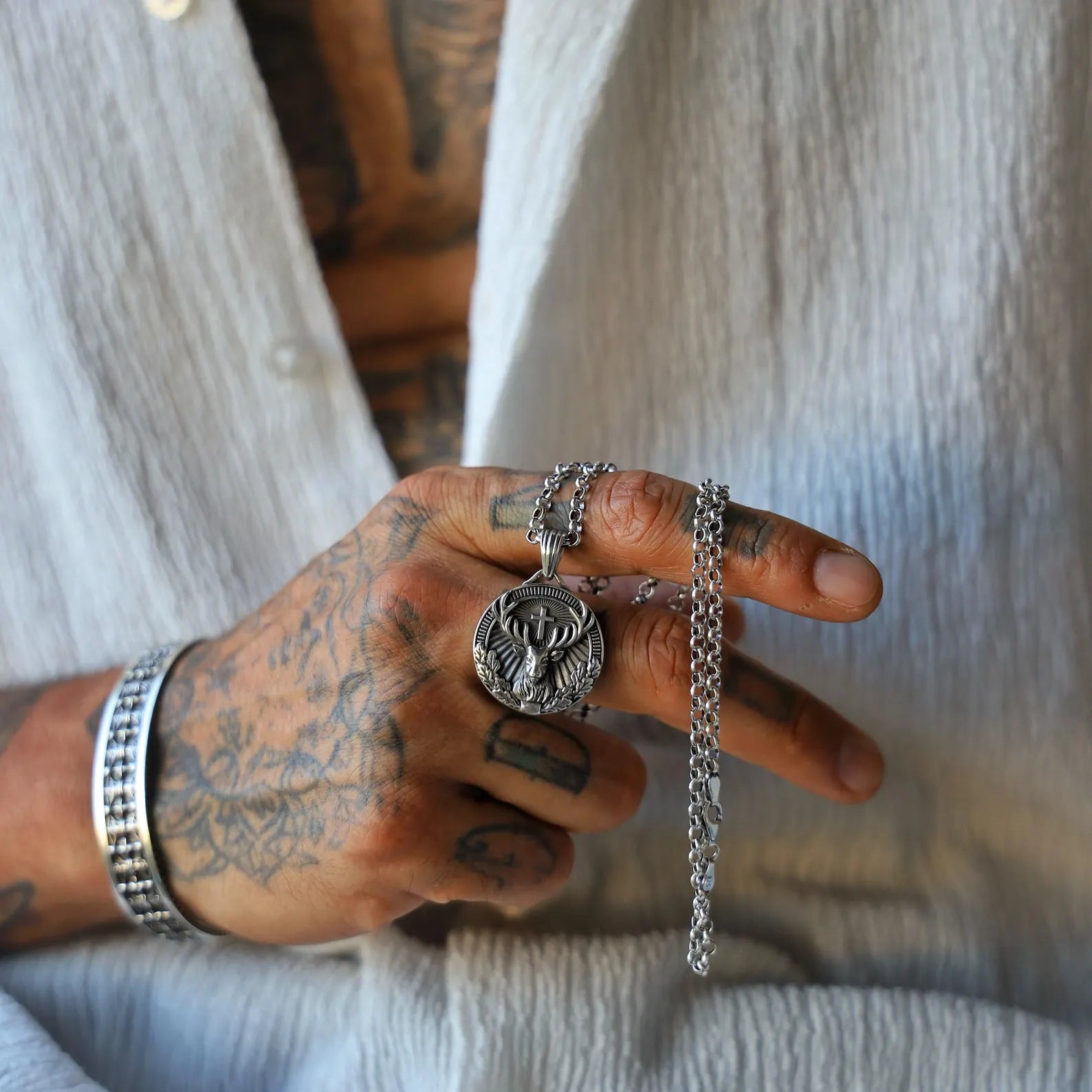 Elegant and meaningful St. Hubertus silver pendant necklace for him, designed with gothic and classical influence, handcrafted to offer a spiritual connection and lasting style for those drawn to religious jewelry.