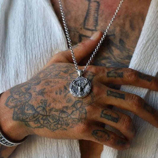 Sterling silver St. Hubertus pendant necklace showcasing detailed engraving of the patron saint of hunters, with an antique finish and spiritual symbolism, perfect for men who appreciate religious heritage and elegant craftsmanship.