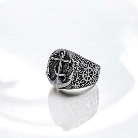 A handcrafted sterling silver anchor ring designed for men who appreciate nautical-inspired jewelry. This statement piece features a meticulously detailed anchor symbol representing strength, resilience, and a love for the ocean. Made with high-quality 925k silver, the ring reflects maritime traditions and adds a bold yet meaningful touch to any jewelry collection. Perfect for sea lovers, sailors, or anyone drawn to timeless nautical fashion.
