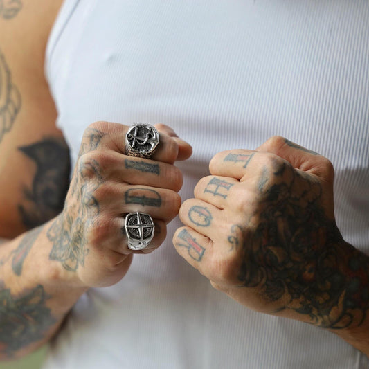 Styled on the hand, this silver anchor ring brings a nautical-inspired touch to any ensemble. The bold yet minimalist design complements casual and formal looks alike, while the weight and feel of the sterling silver exude a sense of confidence and character. Ideal for daily wear or special occasions, it’s a timeless piece for those who carry the spirit of the sea within them.