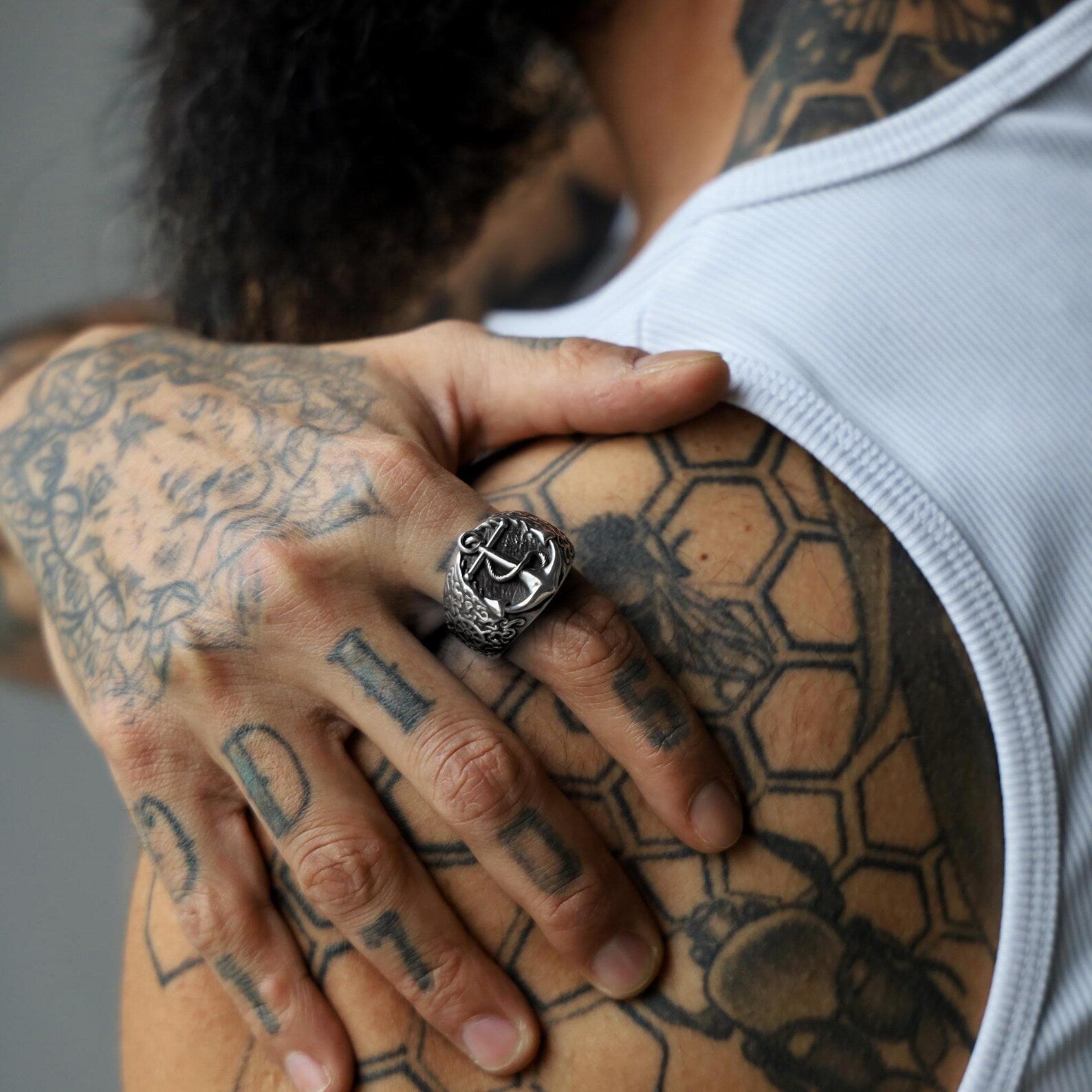 A focused angle captures the sturdy 4mm thickness of the ring, emphasizing both its presence and durability. This handcrafted piece is more than an accessory—it’s a symbol of strength and resilience, crafted for men who embrace both modern minimalism and the rich tradition of maritime adventure. A true testament to artisan quality and enduring style.