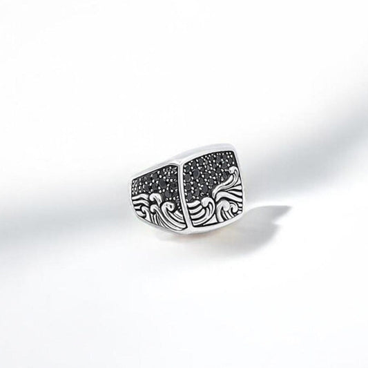 This handcrafted sterling silver ocean wave ring features a beautifully detailed engraving of sea waves and a starry night sky. Made for ocean lovers, surfers, and those who feel connected to the water, this ring combines strength, symbolism, and elegance in one powerful accessory. Its 925K silver body weighs 22 grams, offering a bold, masculine presence with exceptional craftsmanship.