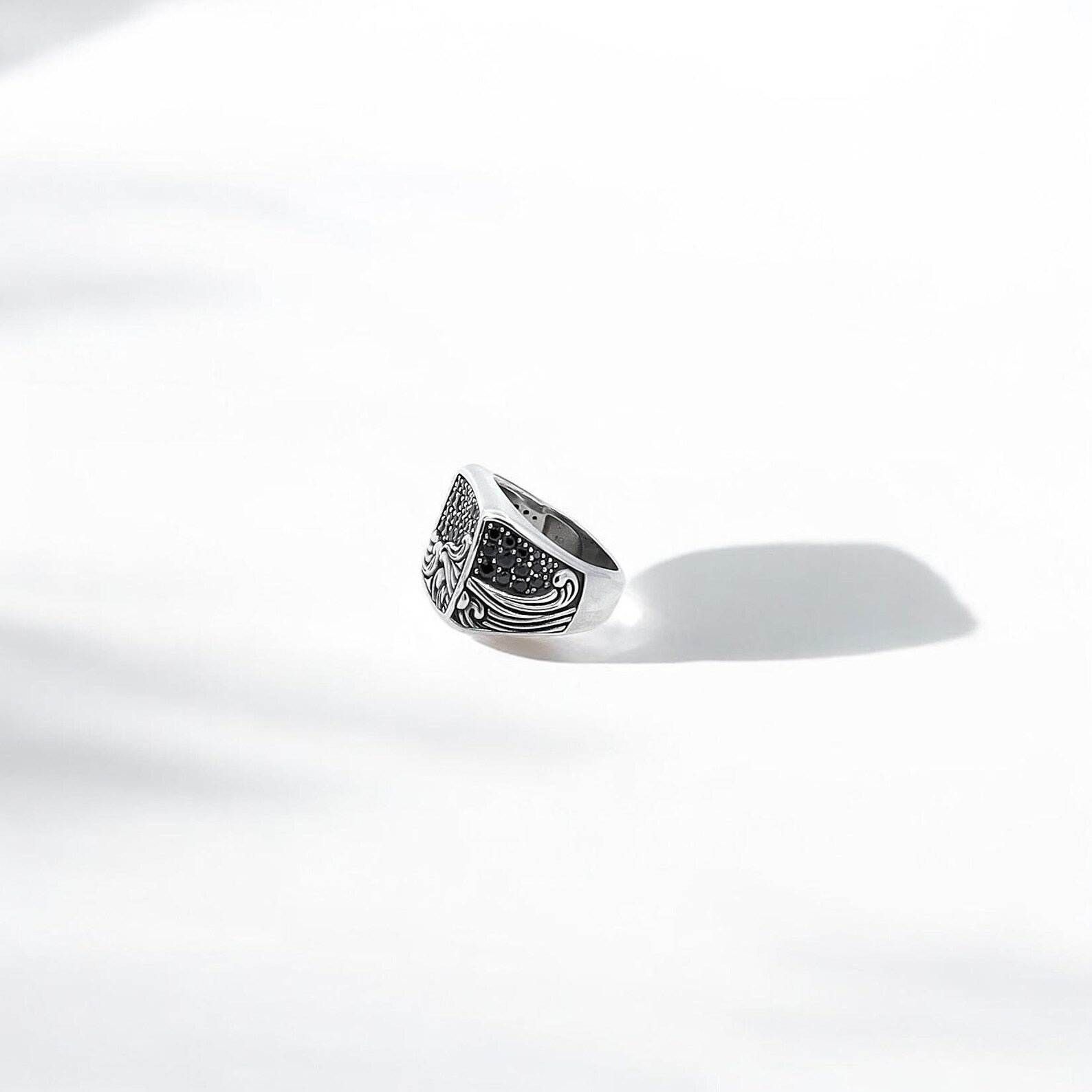 A bold and artistic sterling silver ring featuring crashing wave engravings under a constellation-filled night sky. This unisex ring is ideal for those who love nautical, fantasy, or bohemian jewelry styles. Each piece is meticulously handcrafted to evoke the majesty of the sea and the mystery of the stars above.