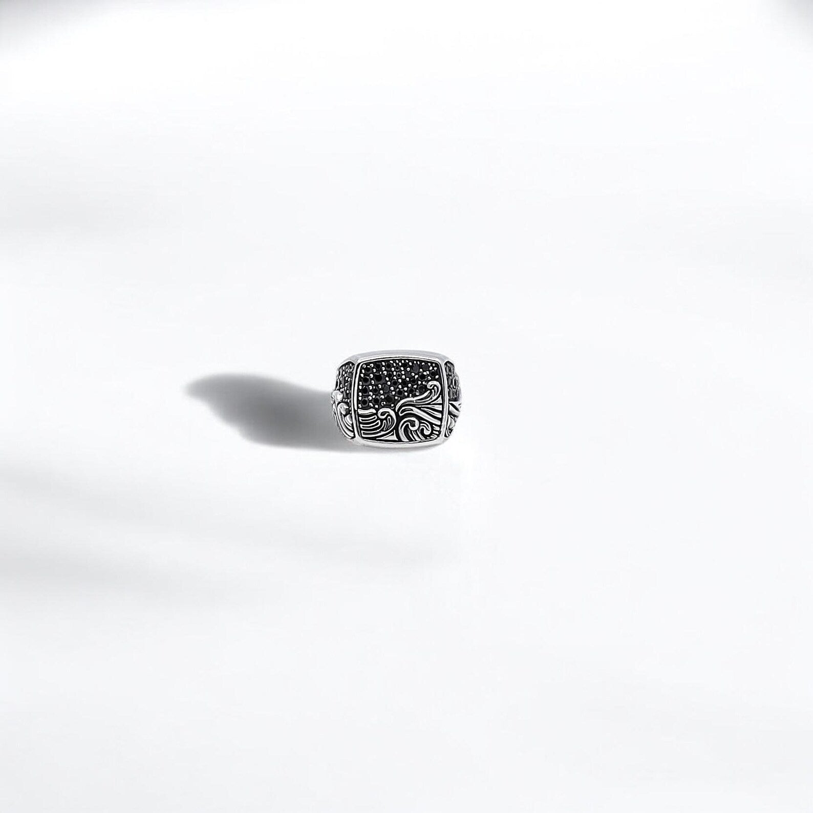 This solid sterling silver wave ring captures the spirit of the ocean through its hand-engraved design. The ring’s width and thickness give it a strong and timeless feel, while its nautical theme makes it a meaningful gift for surfers, sailors, and beach enthusiasts. Perfect for everyday wear or as a personal talisman of inner strength and flow.