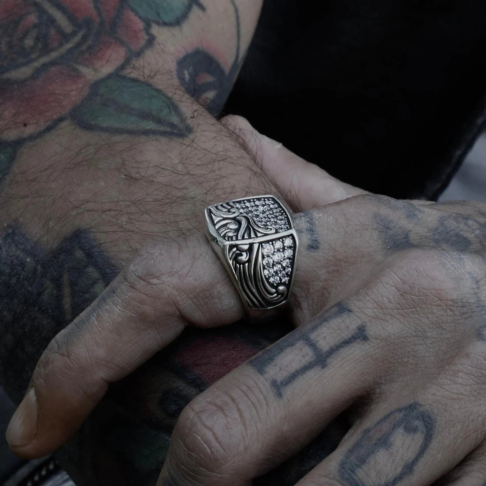 Crafted with precision and passion, this sterling silver sailor ring captures the motion and spirit of the sea. The ring’s face is set with finely cut zircon stones, offering a brilliant shine that mimics sunlight on ocean waves. The band features engraved water patterns that wrap around the finger like a continuous current. A powerful piece for modern men who connect with the ocean’s energy and live with depth and intention.