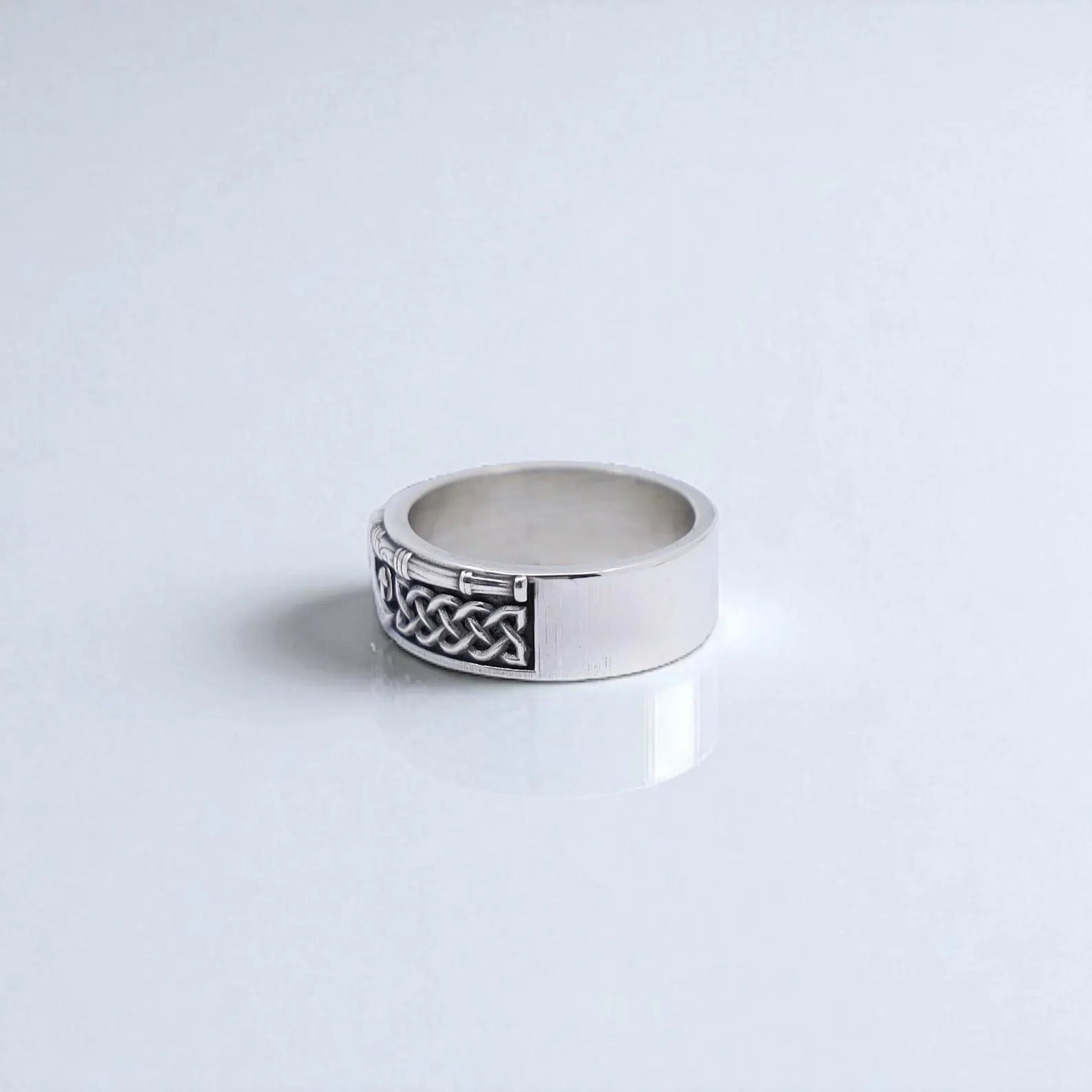 Handmade sterling silver Viking warrior ring for men, with a central skull detail and side engravings of axes and Nordic symbols. The oxidized finish brings depth to every carved line. Ideal for gothic fashion enthusiasts, collectors of Norse jewelry, or those seeking a meaningful and fierce men's gift.
