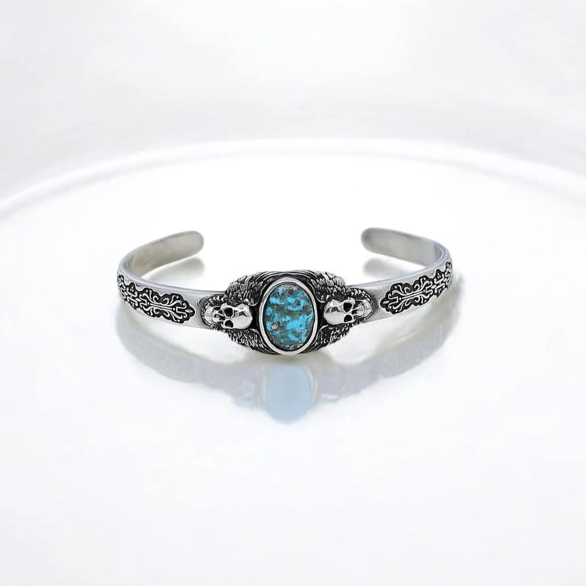 Elevate your style with this men’s turquoise stone silver bracelet featuring an intricate skull motif that captures the dark allure of gothic jewelry. Handcrafted with precision and inspired by rugged biker style and Western vibes, this bold statement piece combines masculine elegance with spiritual energy, making it an ideal accessory for those who appreciate alternative fashion and meaningful jewelry