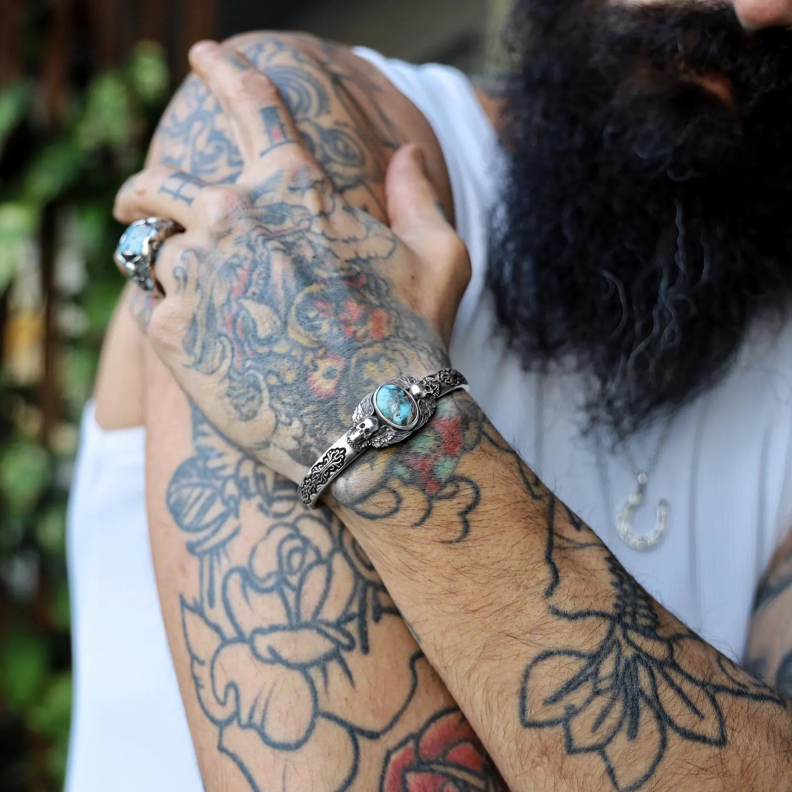 Detailed shot highlighting the solid build and rugged appeal of this men’s turquoise silver skull bracelet: 35 grams of handcrafted sterling silver, 160mm adjustable diameter, 20mm height, and 6mm thickness. This bold and masculine piece combines gothic skull symbolism with the calming energy of turquoise, making it a perfect choice for those who love alternative and spiritual jewelry.