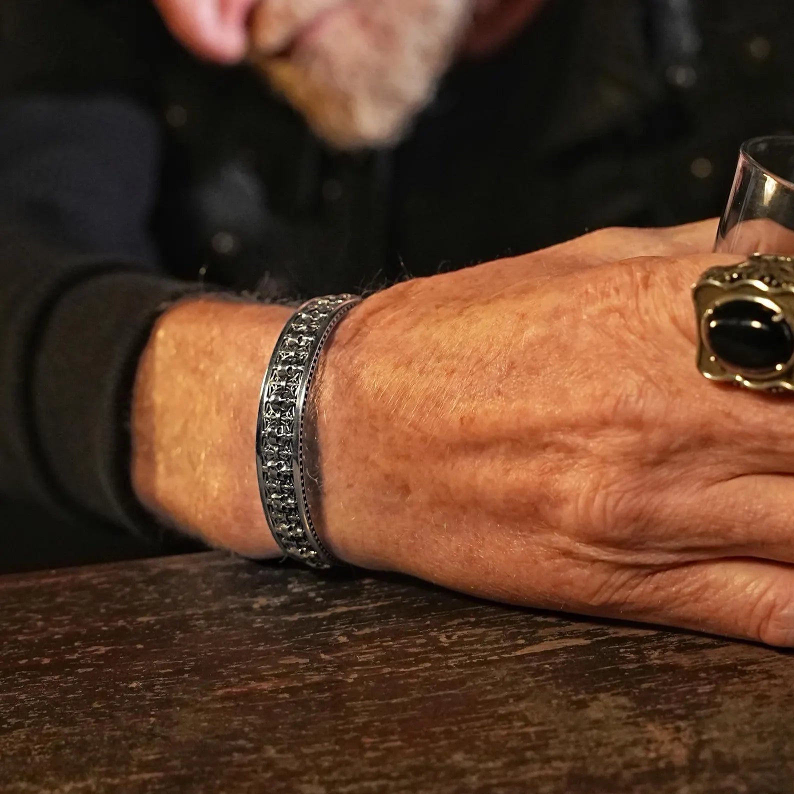 Detailed shot showcasing the solid craftsmanship of this men’s gothic skull cuff bracelet: 160mm adjustable diameter and 12mm thickness. This bold and substantial sterling silver bracelet combines rugged biker charm with refined gothic style, perfect for men who appreciate statement jewelry with powerful symbolism.