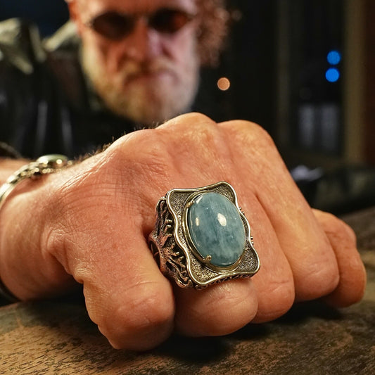 This silver sailor ring showcases a polished aquamarine gemstone set in a vintage-style engraved compass design. Inspired by nautical themes and Norse legends, this handcrafted ring is an ideal gift for him — reflecting strength, clarity, and direction through life’s journey.