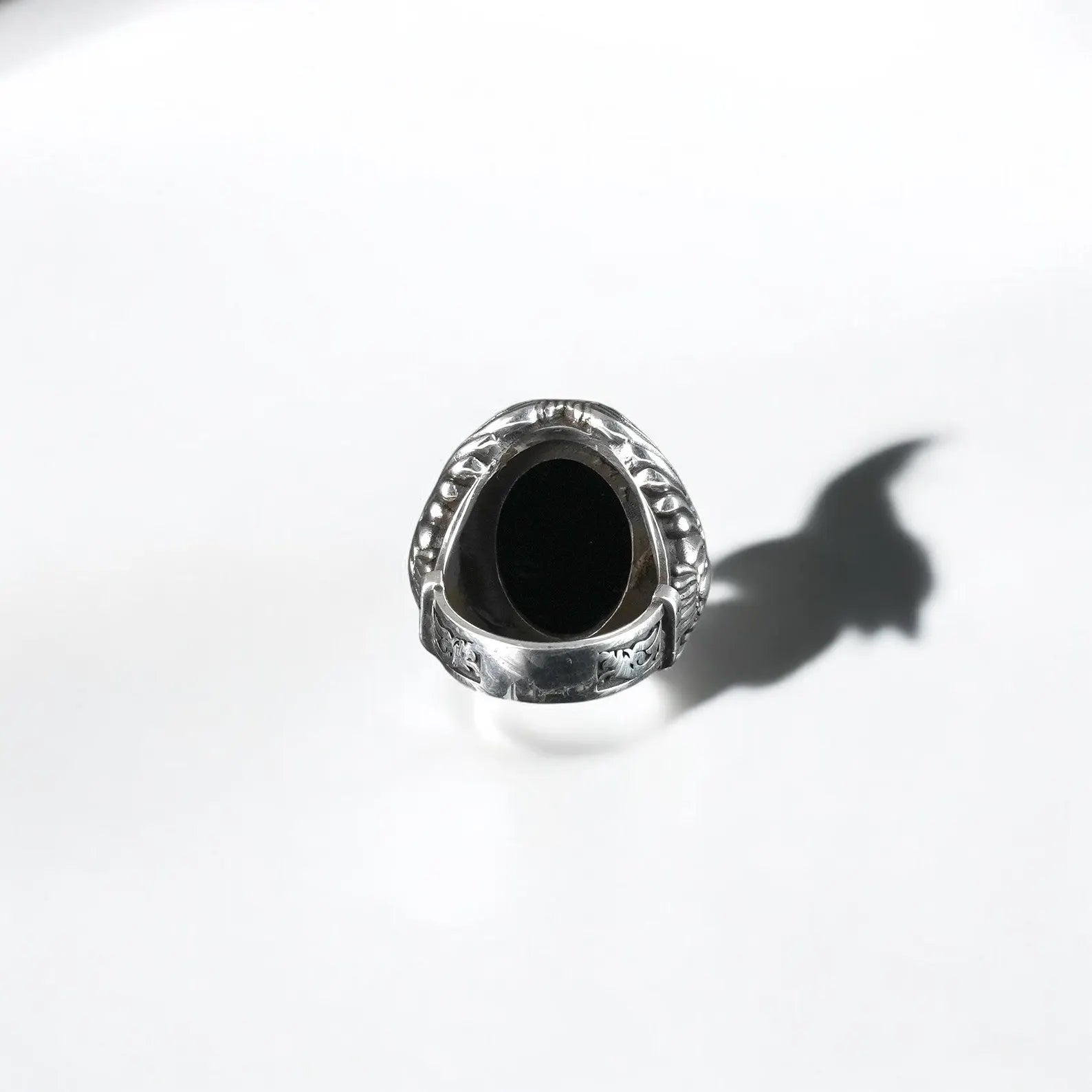 This handcrafted sterling silver ring with a bold black gemstone is shaped in the form of an eagle talon gripping an onyx stone. Designed for fearless individuals who value symbolism, personal expression, and custom-made jewelry with depth.