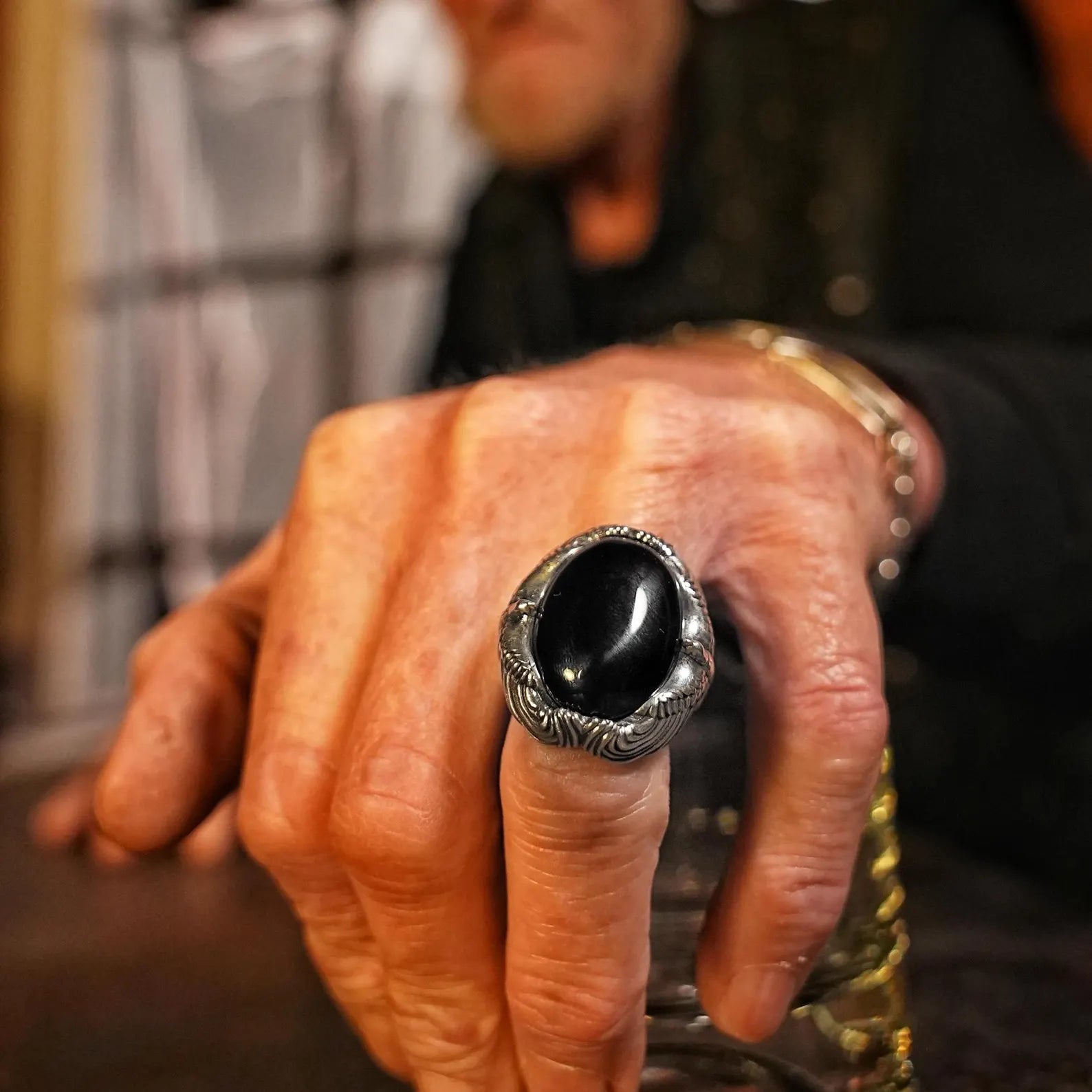 A striking silver onyx ring for men designed with an intricately sculpted eagle motif holding a bold black stone. This handcrafted piece offers both visual impact and symbolic energy, making it the perfect gift for those who appreciate Viking aesthetics and gothic masculinity.