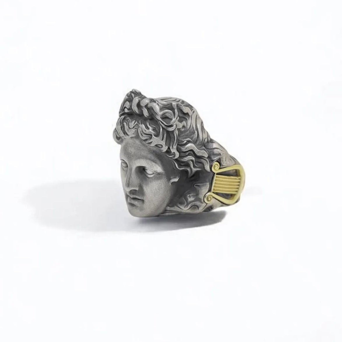 Handcrafted sterling silver and gold plated Apollo ring featuring a design inspired by ancient Greek mythology. This bold statement piece honors Apollo, god of music and light, with powerful symbolism and timeless elegance. A unique gift for men who value history, legend, and fine craftsmanship in their jewelry.