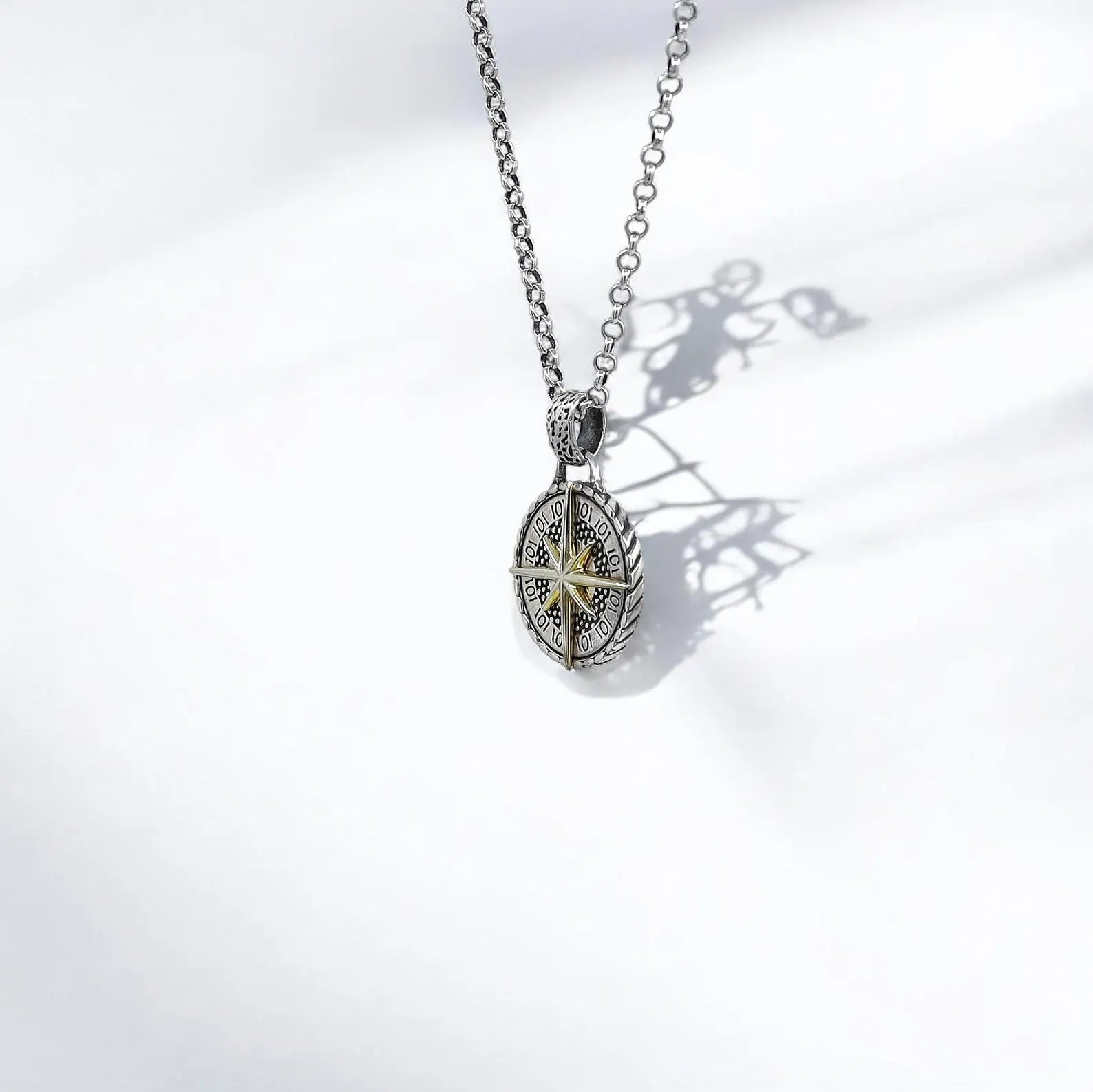 A symbolic and elegant compass necklace combining sterling silver and 14k gold, perfect for beach lovers, world travelers, or those navigating life with purpose. This handcrafted pendant adds a touch of refinement and adventure to any look, making it a top gift choice for him or her.