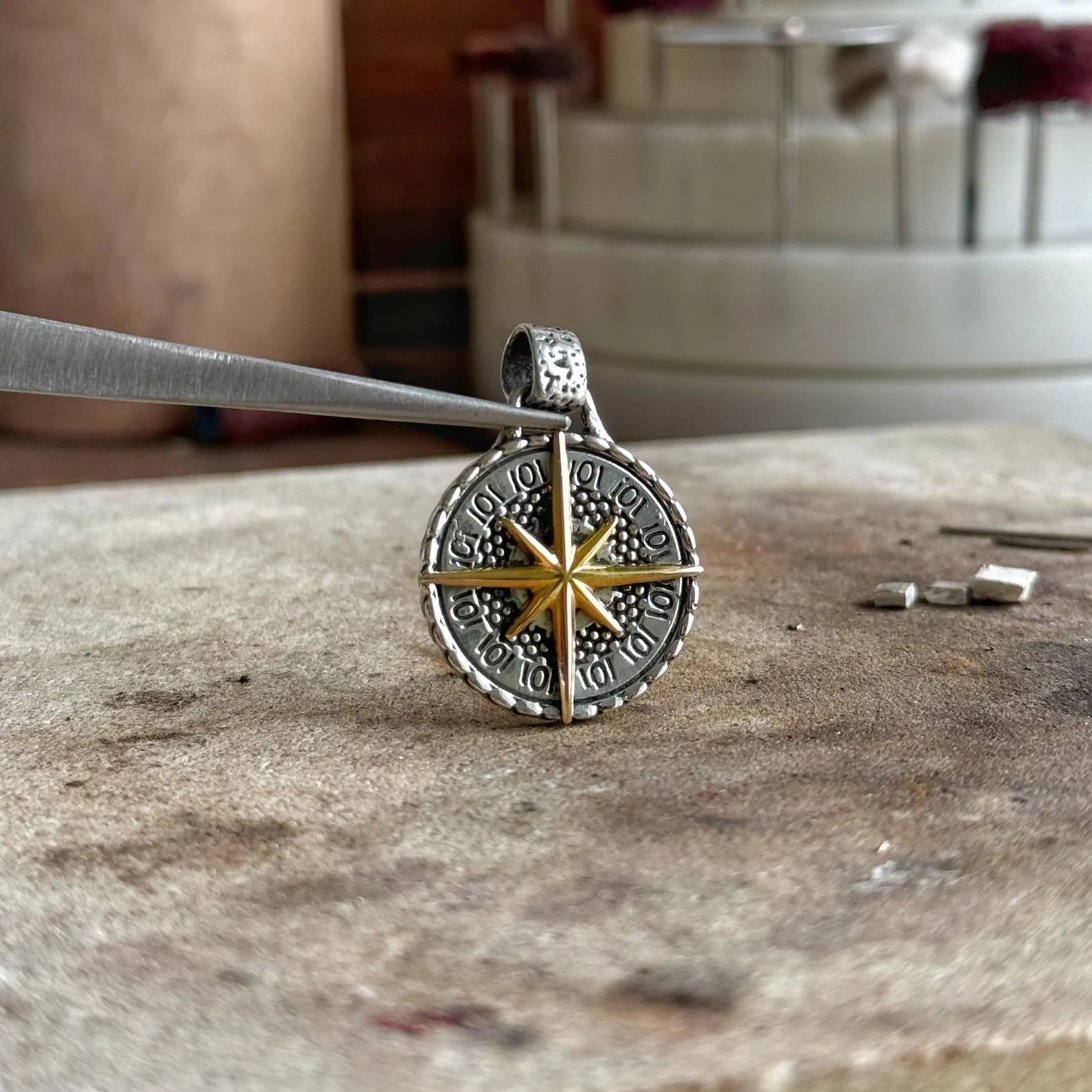 This nautical compass pendant necklace is a handcrafted treasure featuring a brilliant mix of sterling silver and 14k gold detailing. With its bold shape and spiritual meaning, it is ideal for gifting to those who draw inspiration from the sea, freedom, and the path they choose to follow.