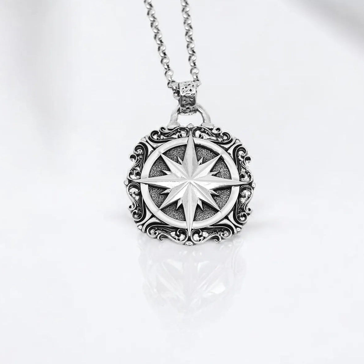 Handcrafted sterling silver compass pendant necklace featuring a large, intricately designed nautical medallion. With a bold 42g weight and 2.36-inch height, this statement piece is perfect for men and women who appreciate rustic elegance and symbolic jewelry. A timeless accessory inspired by travel, direction, and the strength of the inner compass—ideal for wanderers and spiritual seekers.