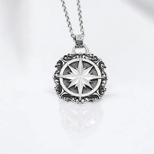 Handcrafted sterling silver compass pendant necklace featuring a large, intricately designed nautical medallion. With a bold 42g weight and 2.36-inch height, this statement piece is perfect for men and women who appreciate rustic elegance and symbolic jewelry. A timeless accessory inspired by travel, direction, and the strength of the inner compass—ideal for wanderers and spiritual seekers.