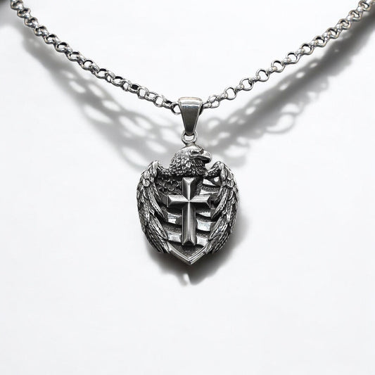 A handcrafted sterling silver cross pendant featuring a bold American eagle motif, symbolizing strength, freedom, and faith. This gothic-style patriotic necklace is a powerful statement piece designed for men who value tradition, national pride, and detailed artisan craftsmanship.