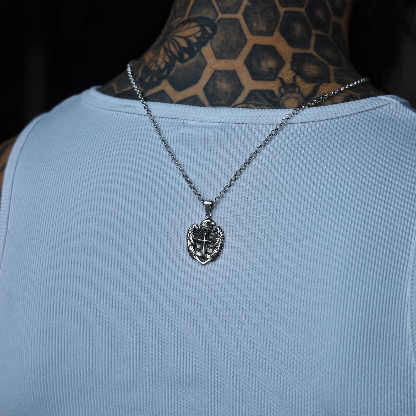 A dramatic studio-lit photo that highlights the depth and symmetry of the pendant’s gothic cross design and the wings of the American eagle. This symbolic silver pendant embodies protection, courage, and belief—making it not just a fashion piece, but a declaration of inner identity. A thoughtful and impactful gift for your husband, boyfriend, or son.