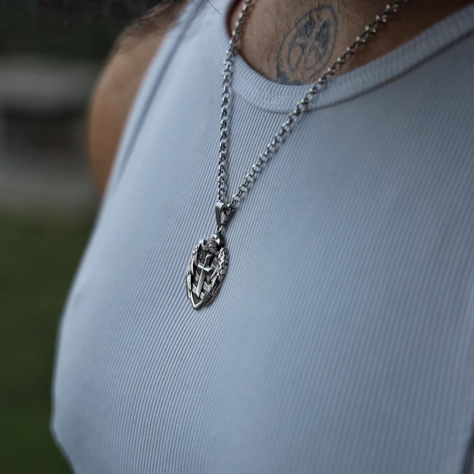 Flat-lay image of the sterling silver patriotic pendant placed on a rugged black leather background, emphasizing its masculine and gothic aesthetic. A top choice for men’s gothic jewelry lovers, this pendant bridges the worlds of spirituality and patriotism, offering a unique statement piece that elevates any outfit. Suitable for daily wear or ceremonial use.