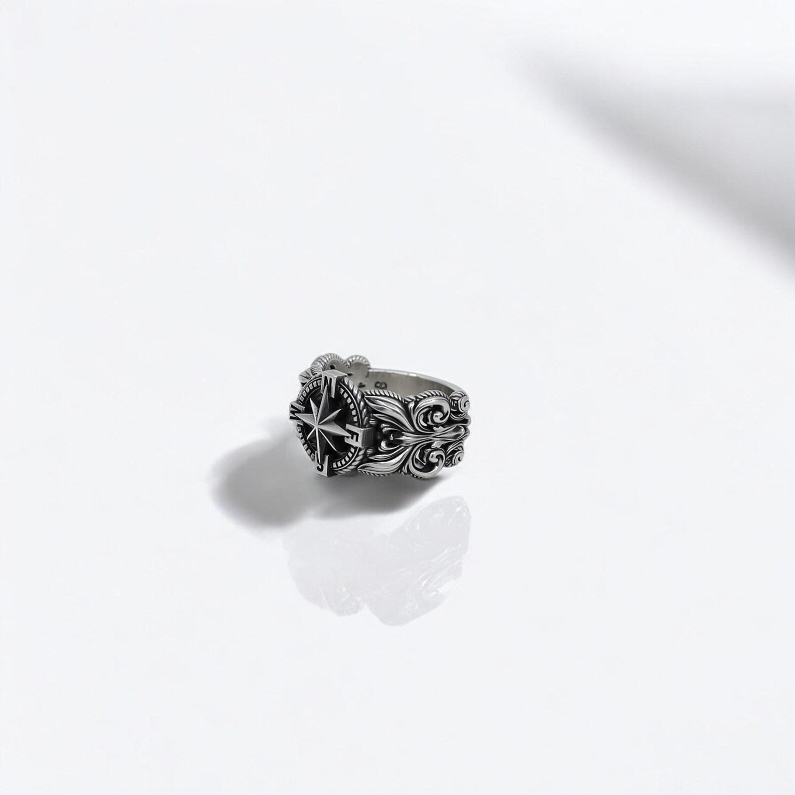 Men’s sterling silver ring with a bold compass motif, handcrafted for nautical style lovers and modern-day adventurers. A rugged yet refined piece of maritime jewelry, great for birthday gifts, travel keepsakes, or personal milestones. Perfect for Shopify and Google product listings.