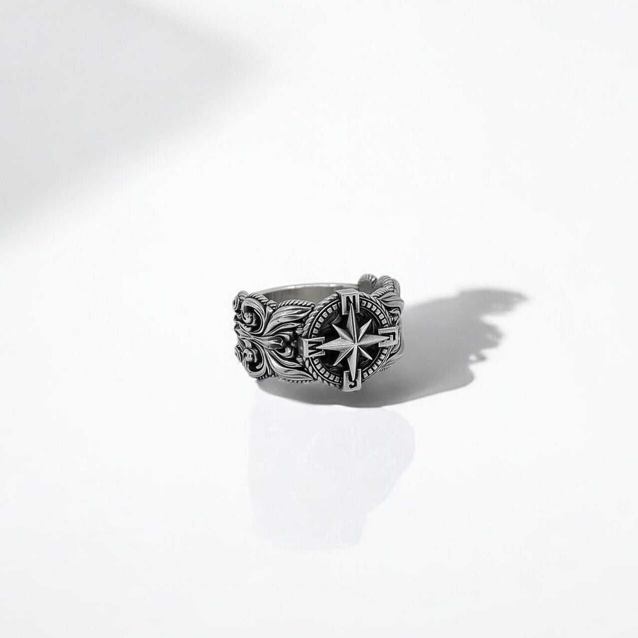 Sterling silver men's compass ring featuring a bold nautical design with intricate maritime detailing. This handcrafted signet ring symbolizes direction, purpose, and adventure—perfect for sailors, travelers, and free spirits. Ideal for Shopify listings, Pinterest gift boards, and Google search optimization.