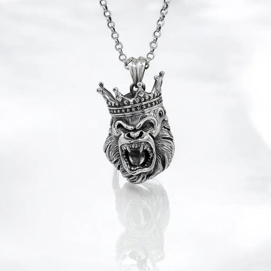 Handcrafted King Gorilla necklace in solid sterling silver, designed to capture the fearless spirit of the wild. Featuring a highly detailed crowned gorilla head pendant, this piece exudes strength, power, and royal presence. Whether you’re drawn to African tribal symbolism or bold animal-inspired fashion, this necklace makes a powerful statement. Ideal for men who lead with confidence and want their jewelry to reflect their personality. A perfect gift for birthdays, anniversary.