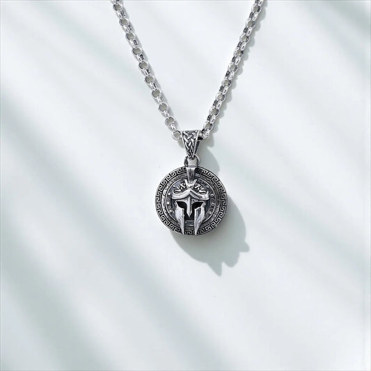 Handcrafted sterling silver necklace featuring a Spartan warrior helmet with shield detailing. Inspired by ancient Greek armor, this bold pendant is a perfect gift for men who admire history, strength, and mythology. Ideal for Shopify warrior jewelry pages, Pinterest gift boards, and Google image search.