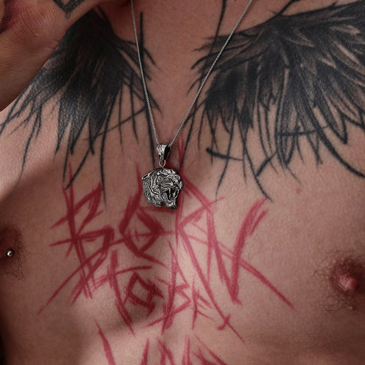 Bold tiger head silver pendant necklace designed for men who appreciate strength, confidence, and fearless style. Made from high-quality sterling silver, this warrior necklace embodies the spirit of the tiger. A rugged and meaningful accessory perfect for men’s fashion, gifting, and statement looks.