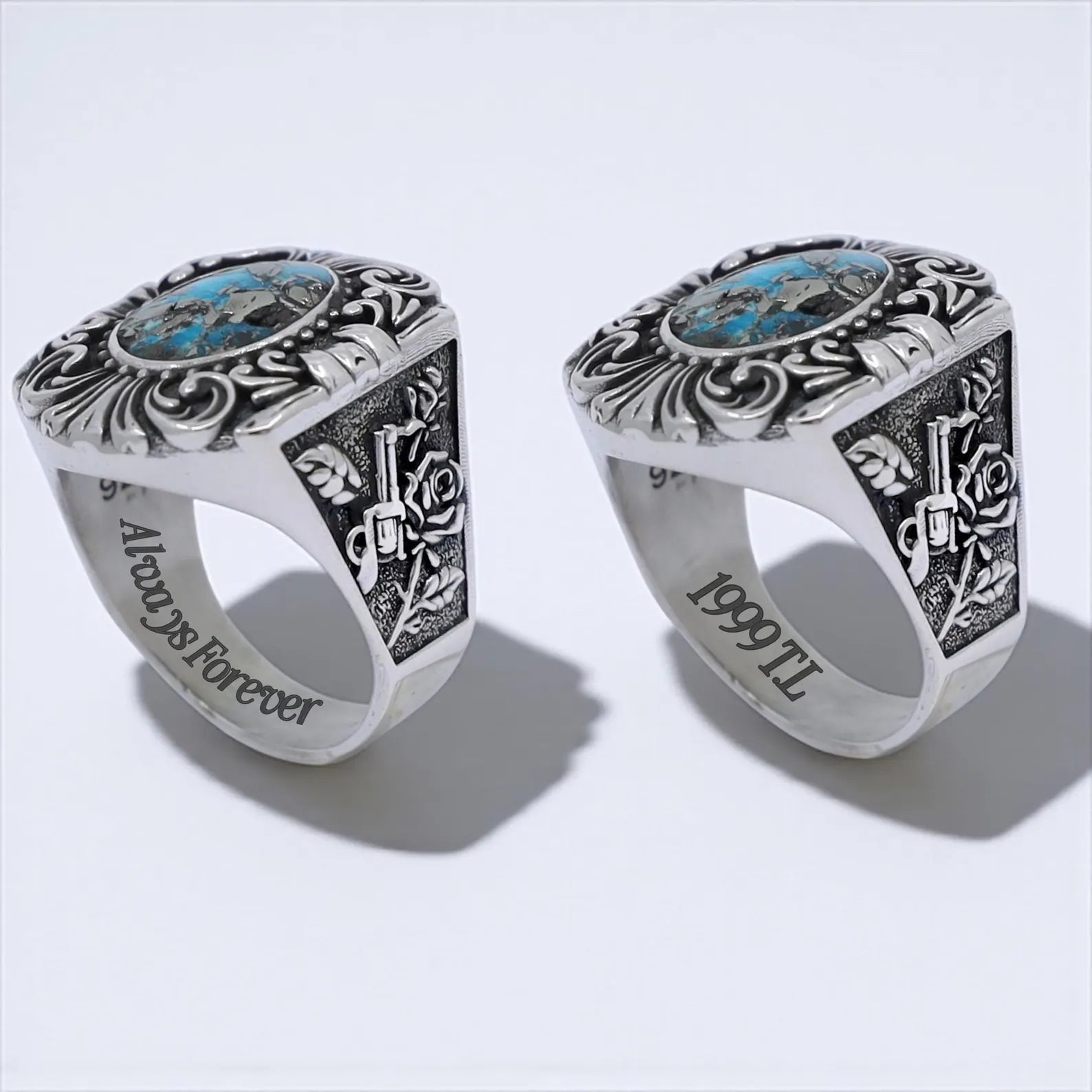 Detailed photo of a turquoise silver ring for men with vintage guns and roses engraved on the sides, showcasing a rugged, handcrafted design perfect for biker, cowboy, or gothic fashion lovers.