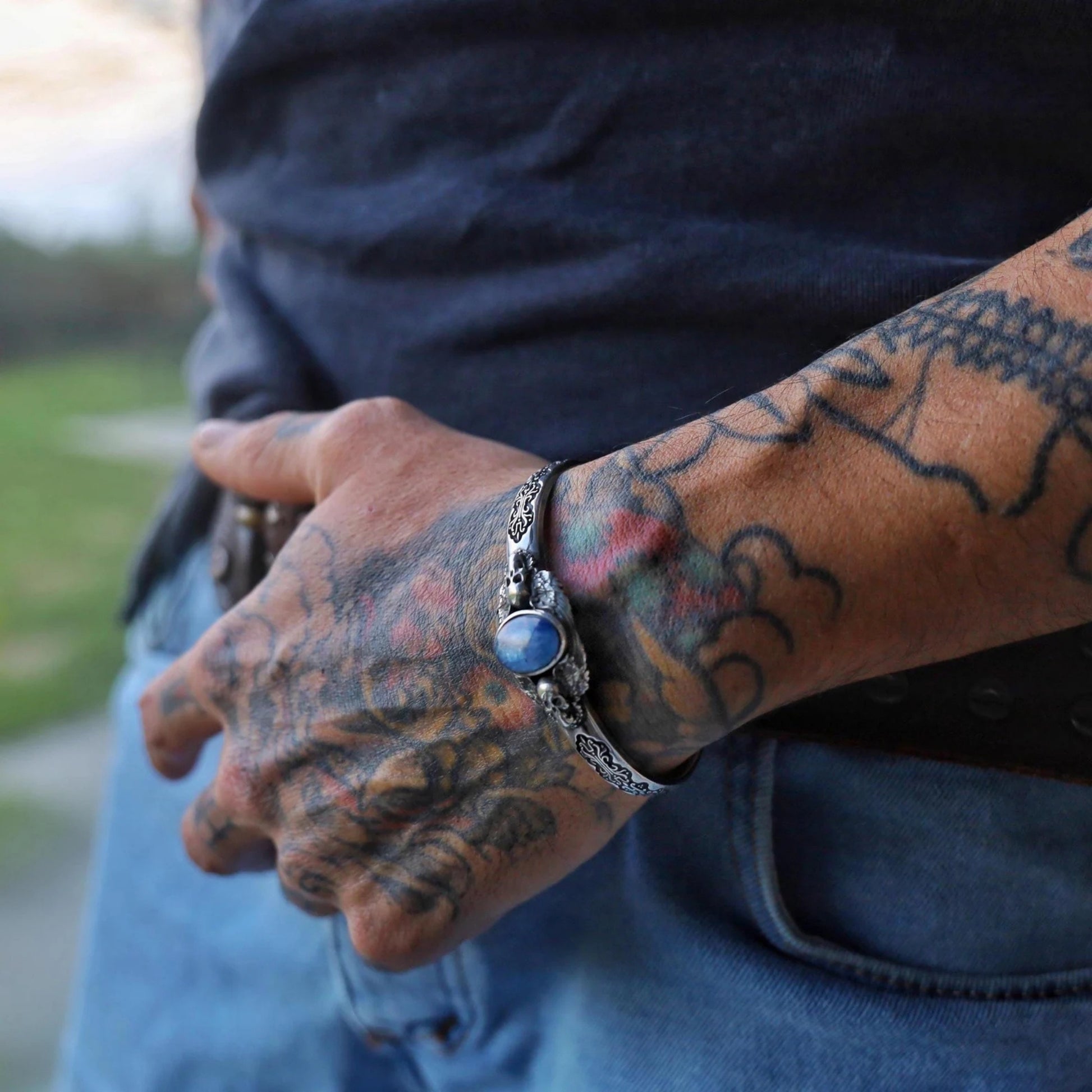 Unique handcrafted gothic skull bracelet made from solid 925 sterling silver with a natural blue kyanite gemstone centerpiece. Designed for men who appreciate dark, luxurious, and meaningful jewelry that tells a story.