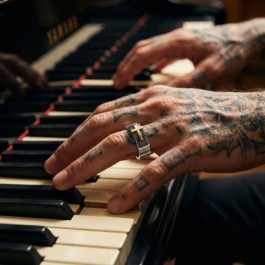 Close-up view of a unique silver wedding band ring showcasing a gold cross symbol, designed as meaningful Christian jewelry for men