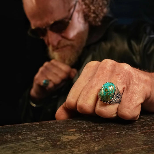 A striking turquoise and silver gothic ring, meticulously handcrafted to capture the essence of freedom and adventure. With wing details and Western-inspired design, this biker-style accessory is a powerful expression of individuality and rugged style for Harley Davidson enthusiasts.