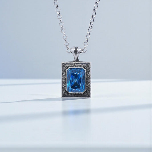Handcrafted 925 sterling silver emerald cut blue topaz pendant necklace featuring a vibrant blue gemstone with a minimalist, vintage-inspired design. Oxidized and hand-polished finish creates a luxurious statement piece, ideal as a personalized anniversary gift, Christmas gift, or birthday present for men